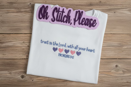 White shirt with religious quote on a wooden surface
